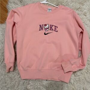 Hello Kitty Nike Women's Light Pink Crew Neck Sweater